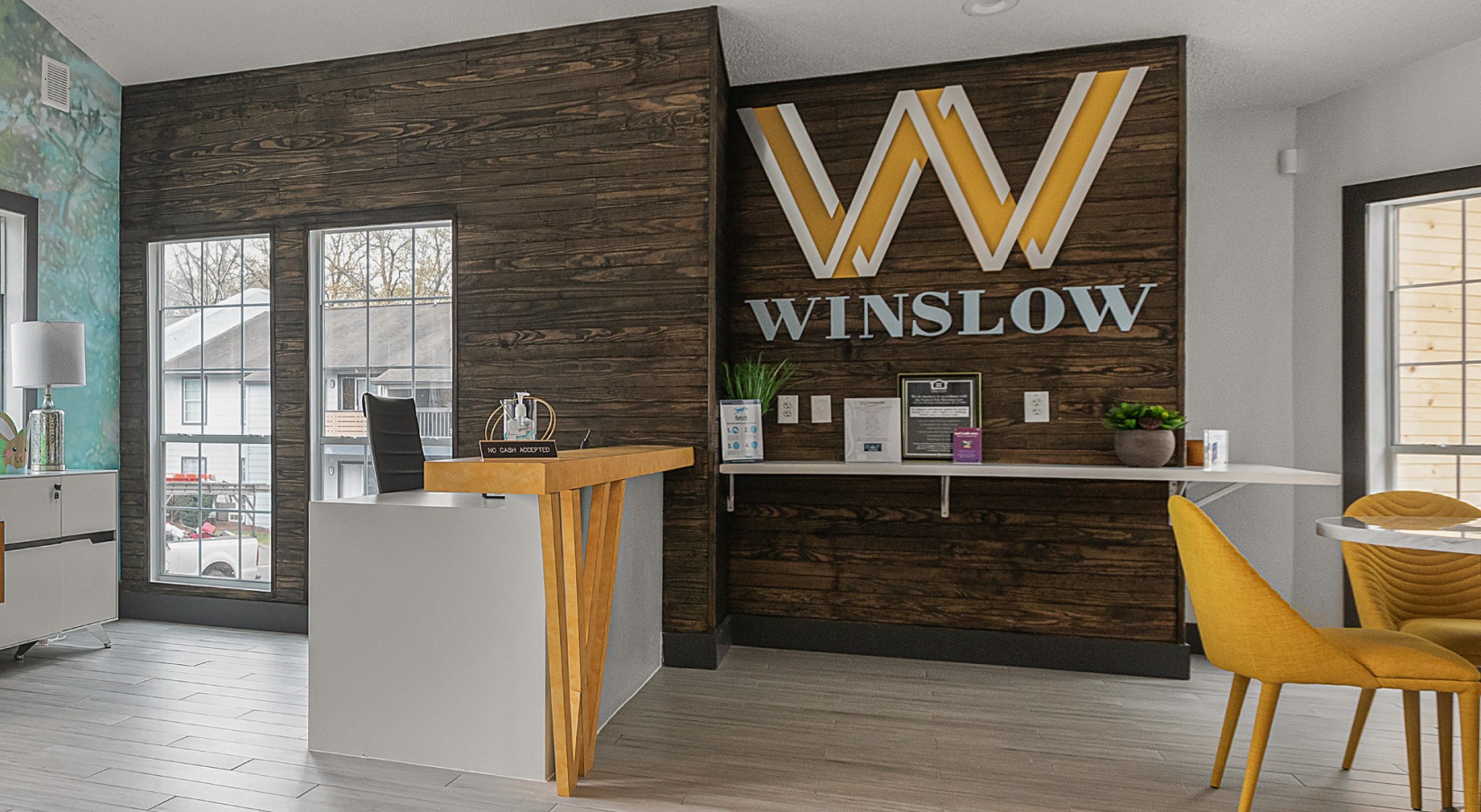 the front desk of a hotel with a sign that says winlow at The Winslow